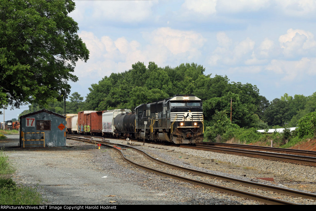 NS 6995 leads train P61 past the old yard